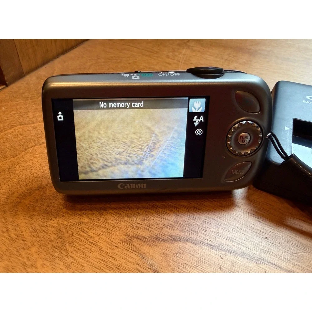 Canon Silver Digital Camera with Black Case and Charger